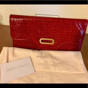 Brand new Jimmy Choo snakeskin red clutch